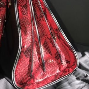 Black and red skin purse.